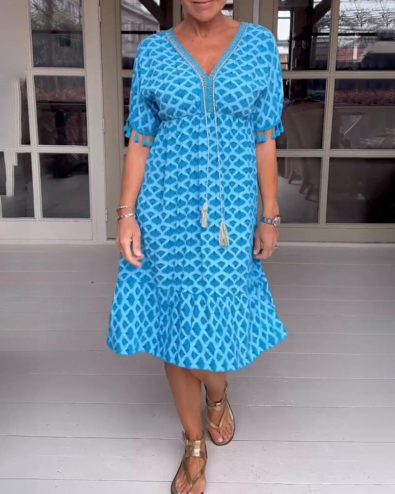 Vestido boho estampado con escote en V y flecos
