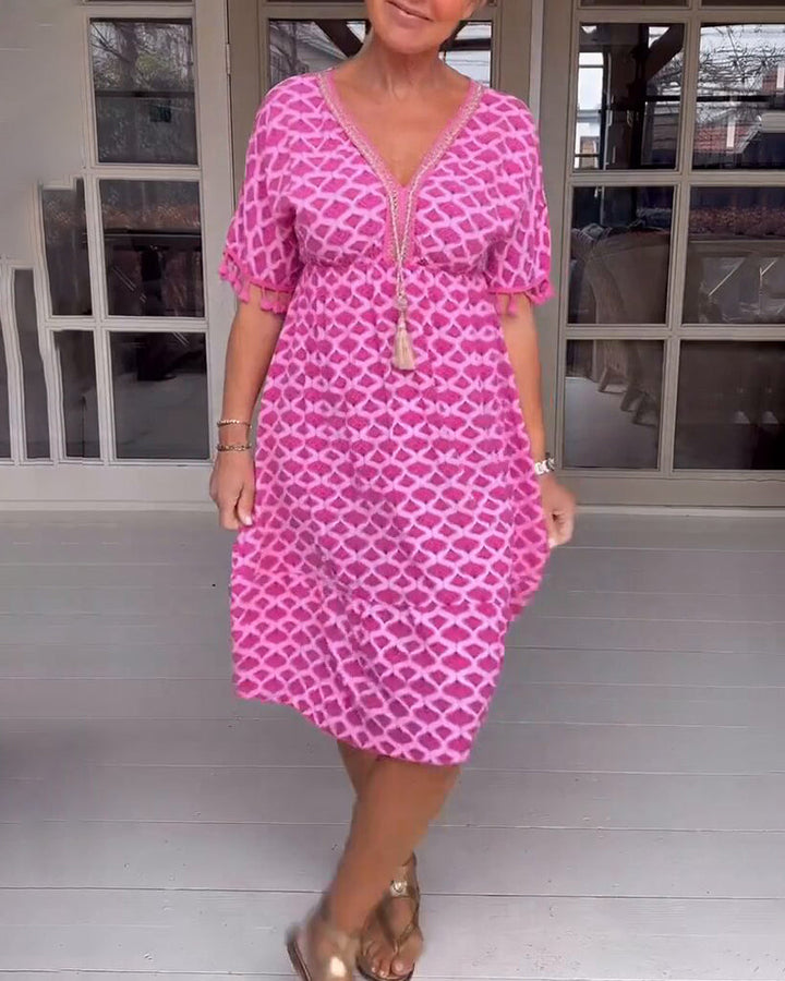 Vestido boho estampado con escote en V y flecos