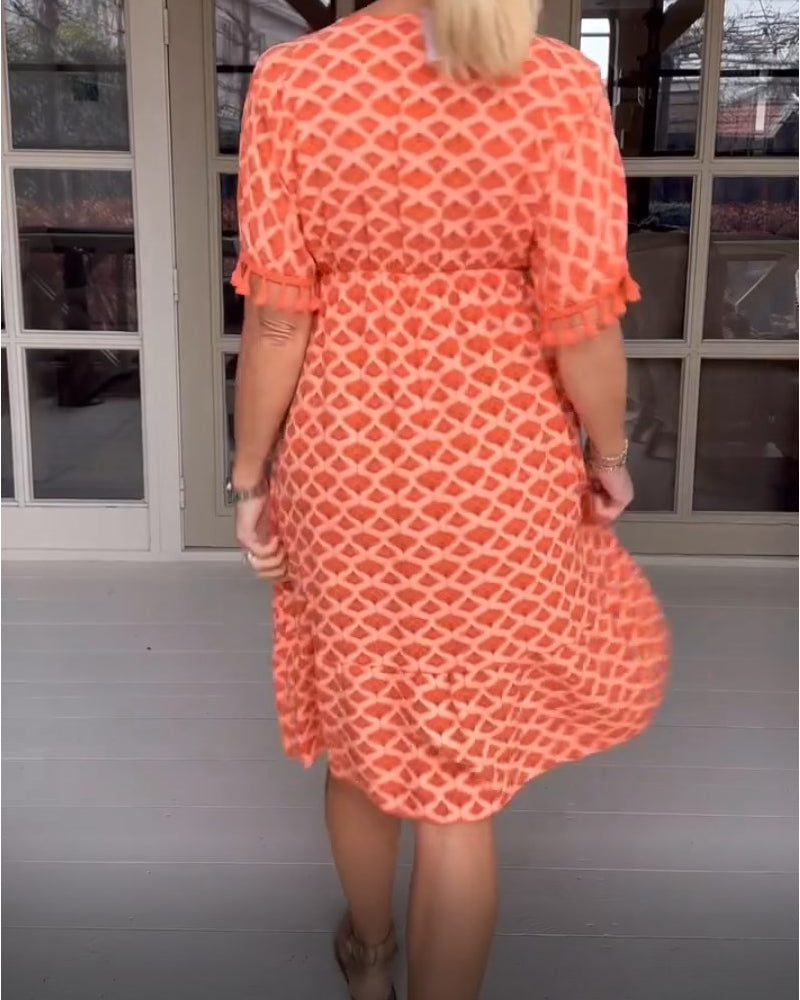 Vestido boho estampado con escote en V y flecos