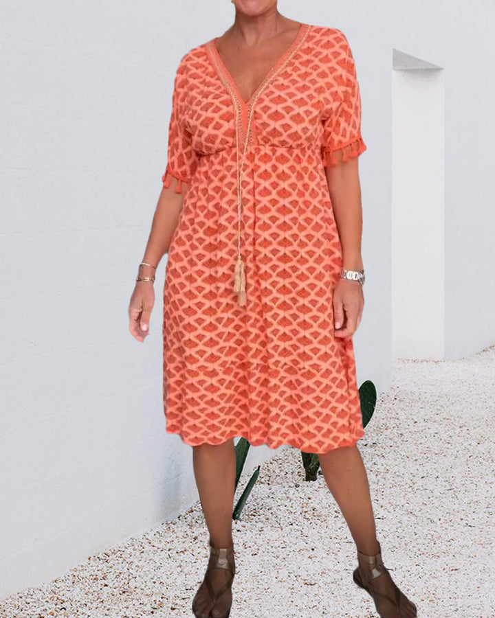 Vestido boho estampado con escote en V y flecos