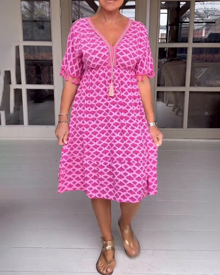 Vestido boho estampado con escote en V y flecos