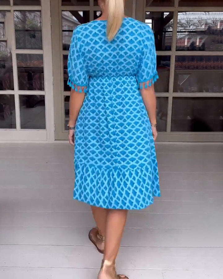 Vestido boho estampado con escote en V y flecos