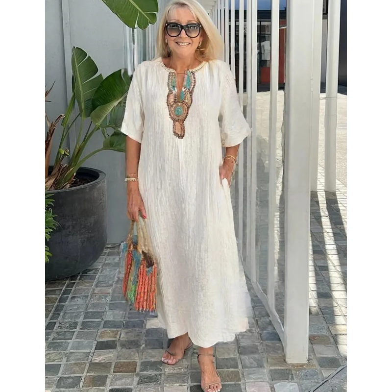 Vestido holgado con abertura bordada